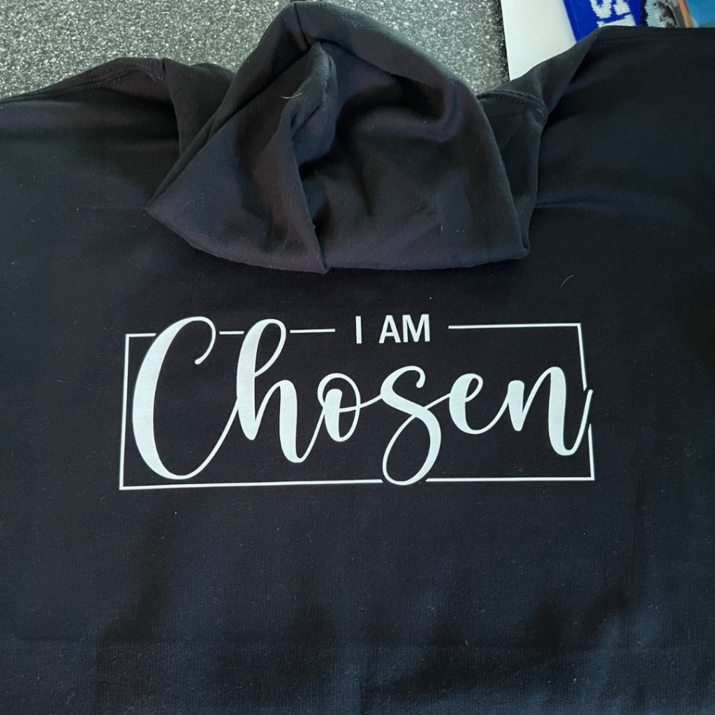 A collection of faith-driven, personalized sweatshirts with various religious symbols and quotes, by Creative Adventure Co.